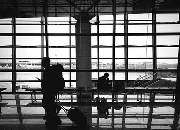 Silhouette of man standing at airport