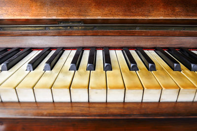 Close-up view of the keys of a ancient ruined piano