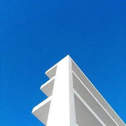 Low angle view of building against clear blue sky