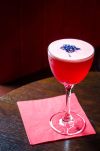 Close-up of red wineglass on table