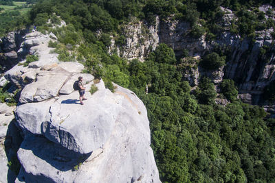 Woman standing on rock