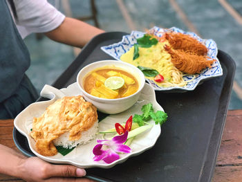 Midsection of person holding food