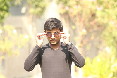 Portrait of boy standing outdoors
