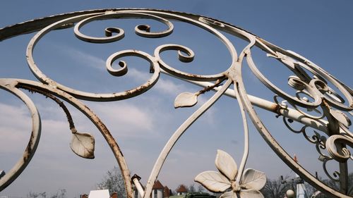 Low angle view of metallic structure against sky