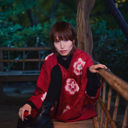 Portrait of a girl sitting outdoors