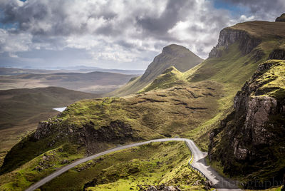 Country road leading towards mountains