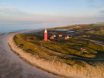 High angle view of beach against sky during sunset