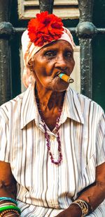 Portrait of woman smoking cigar