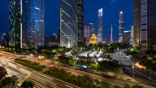 Panoramic view of city street and buildings at night