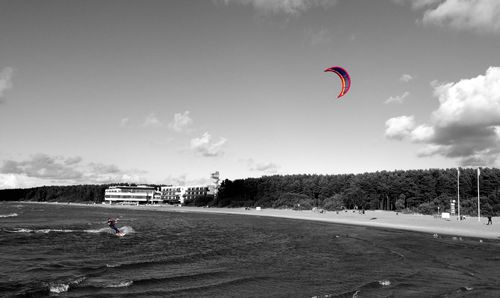 People paragliding in sky