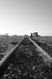 Railroad tracks against clear sky