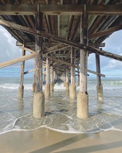 Pier over sea against sky