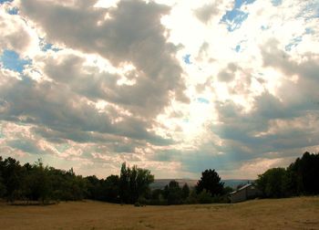 Scenic view of landscape against cloudy sky