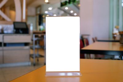 Close-up of empty chairs on table