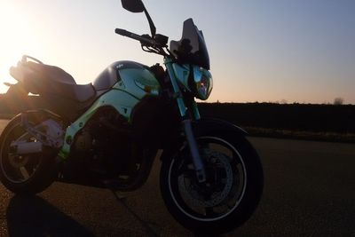 People riding motorcycle on road