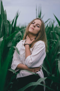 Young woman wearing sunglasses on field