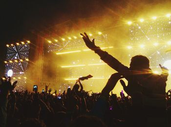 Rear view of people enjoying music concert