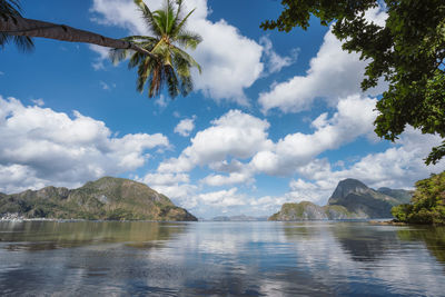 Scenic view of lake and mountains against sky