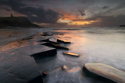 Scenic view of sea against sky during sunset