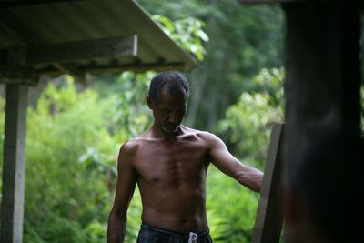 Portrait of young man standing outdoors