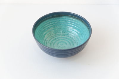 High angle view of blue container on white background