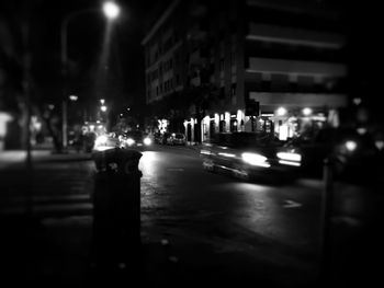 Illuminated city street at night