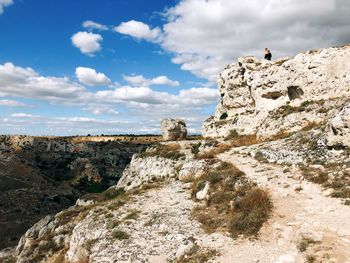 Rock formation on land against sky