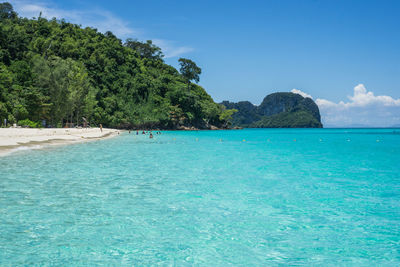 Scenic view of sea against blue sky