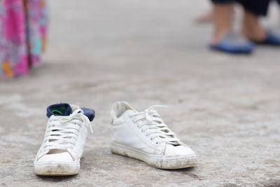 Low section of shoes on street
