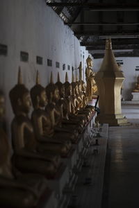Statues in temple outside building