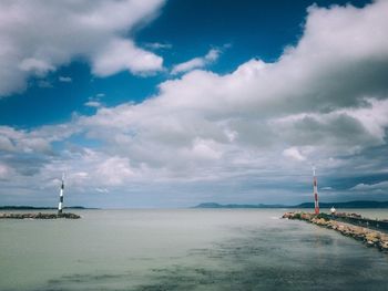 Scenic view of sea against cloudy sky