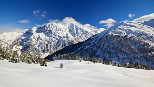 Scenic view of snowcapped mountains against sky