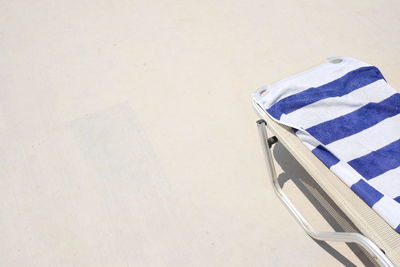 High angle view of chair on beach