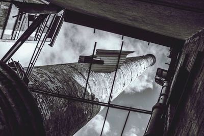 Low angle view of building against cloudy sky