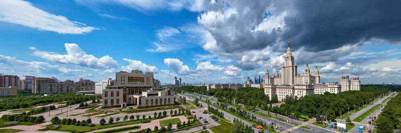 Wide angle autumn panorama of moscow university campus under cloudy dramatic sky