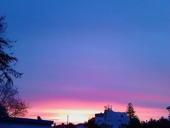 Low angle view of built structure at sunset