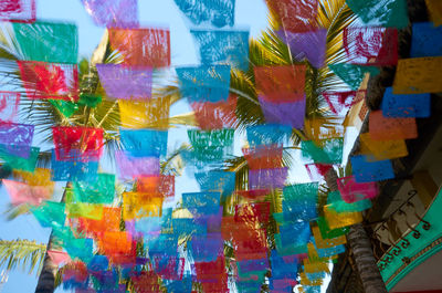 Full frame shot of multi colored umbrellas hanging at shop