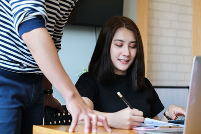 Close-up of a young woman holding hands