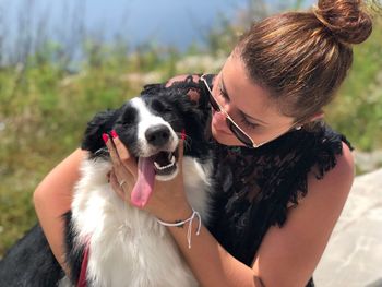 Close-up of woman with dog outdoors