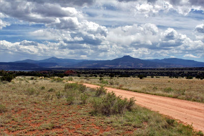 View of landscape against cloudy sky