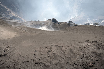 Scenic view of volcanic landscape against sky