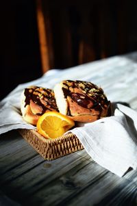 Close-up of breakfast on table against black background