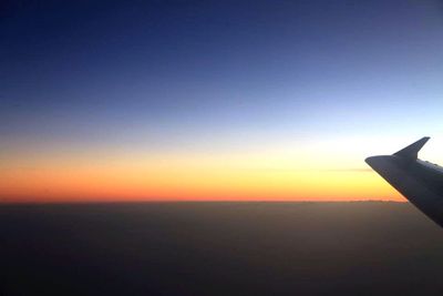 Scenic view of landscape against sky at sunset