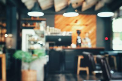 Defocused image of illuminated restaurant