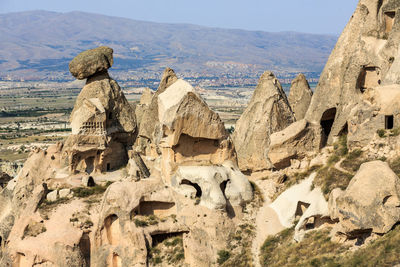 Panoramic view of rock formation and landscape against sky