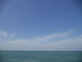 Scenic view of sea against blue sky