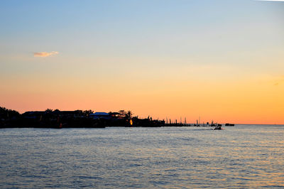 Scenic view of sea against sky at sunset