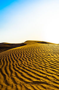 Scenic view of desert against clear sky