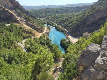 High angle view of river surrounded by rocky mountains