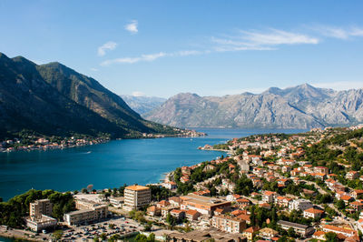 View of town by sea and mountains